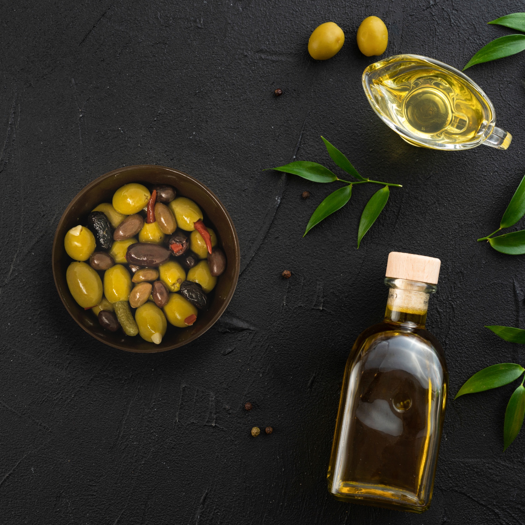 Stuffed olive varieties on wooden spoons